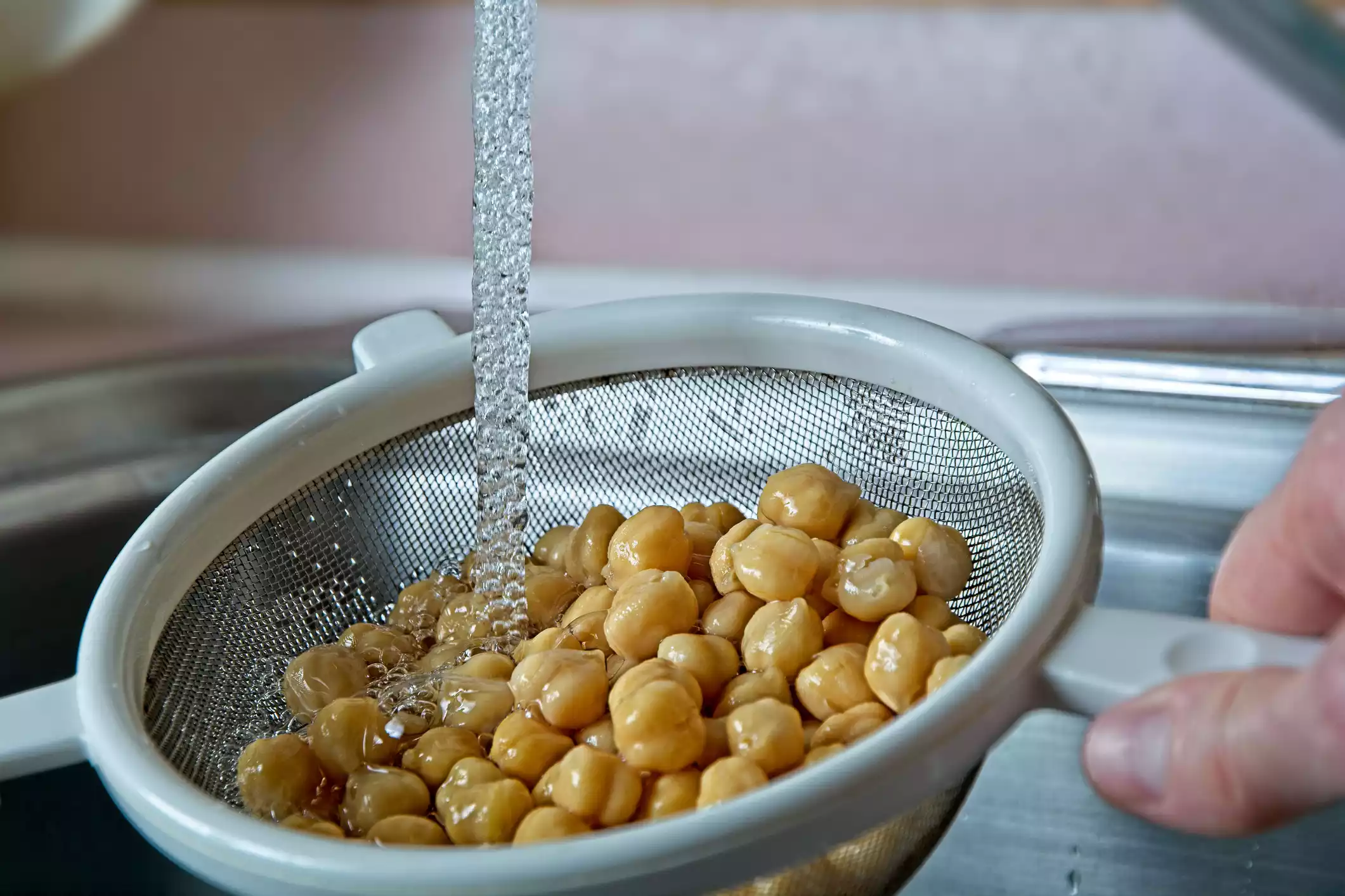 Rinsing chickpeas in the sink