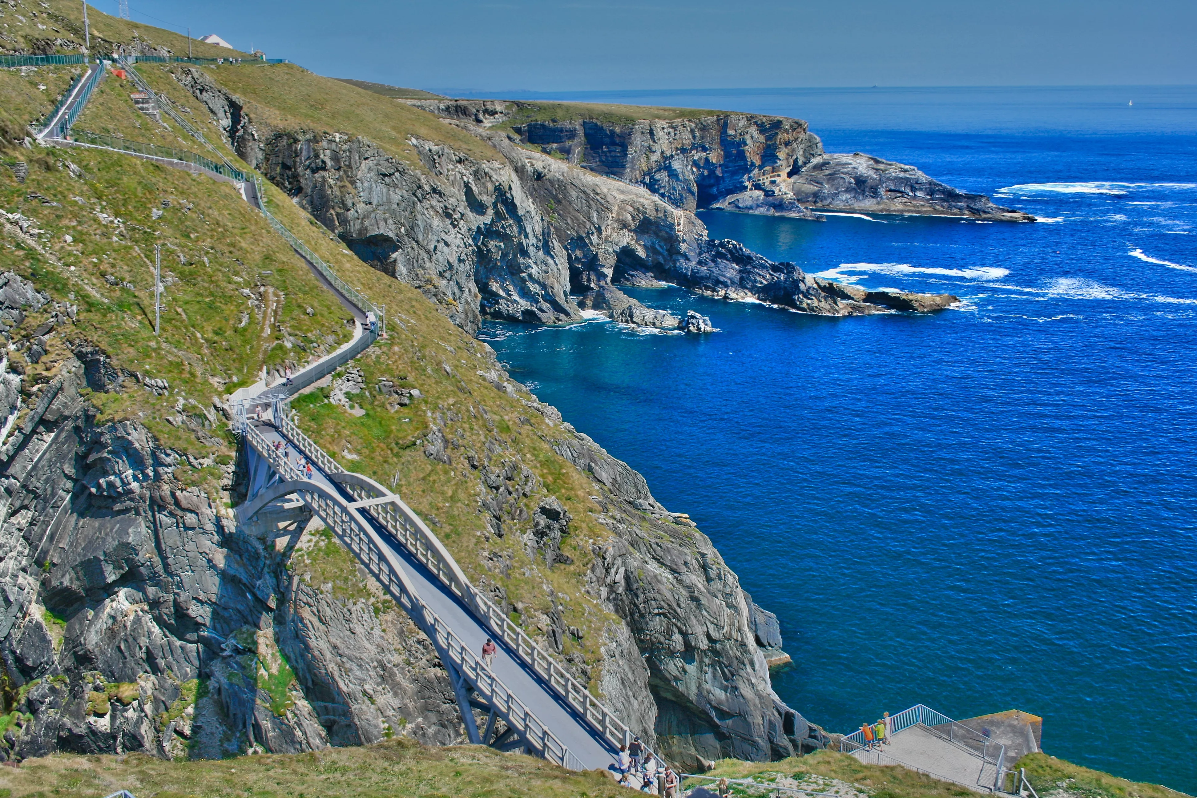 A stunning footbridge connects Mizen Head to a nearby island above deep blue waters