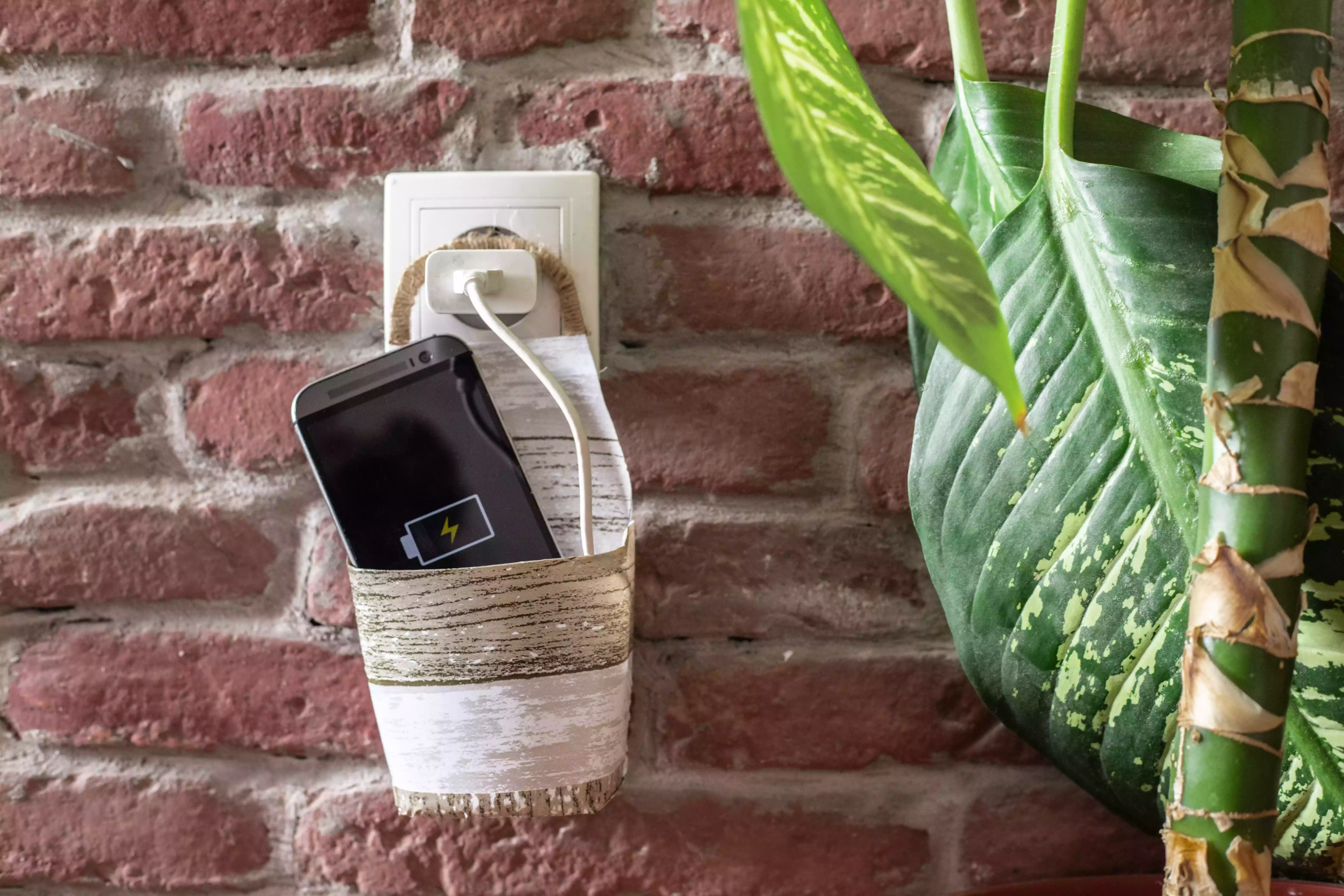 recycled plastic bottle upcycled into cell phone holder for charger