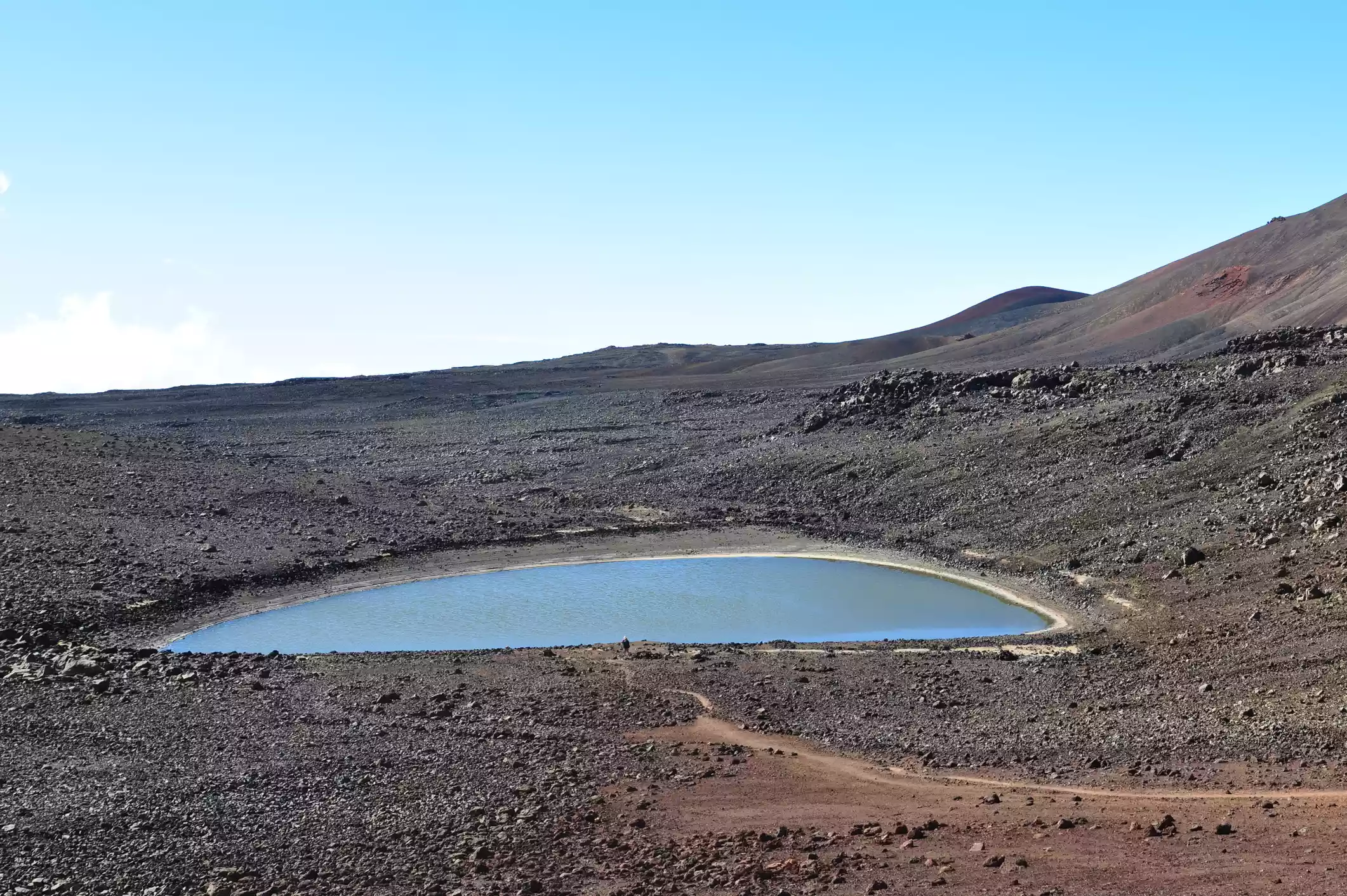 A small lake in a high, volcanic mountain environment